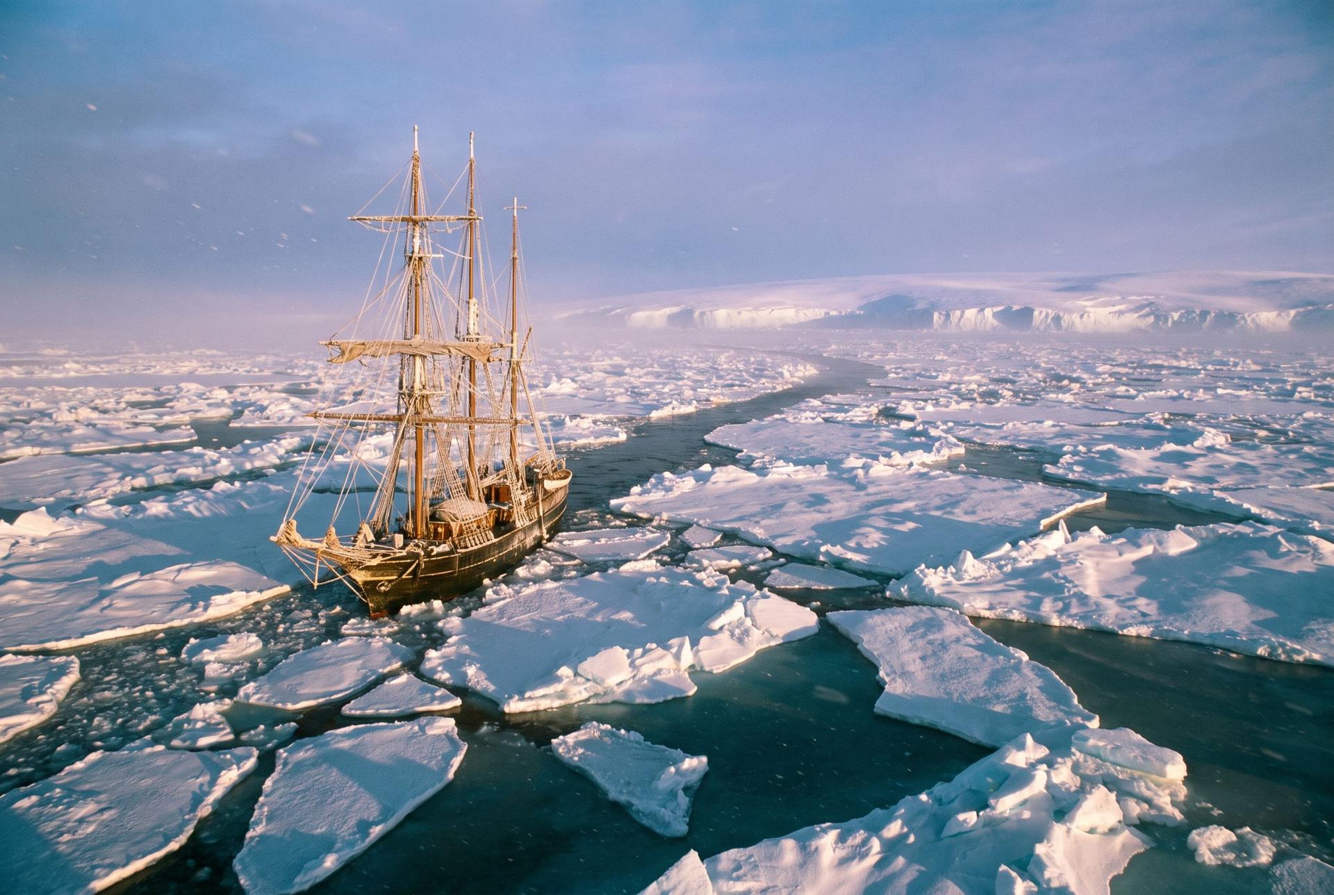 The three-masted ship Endurance among Weddell Sea pack ice, a black lead of open water opening ahead of her bow, 1915